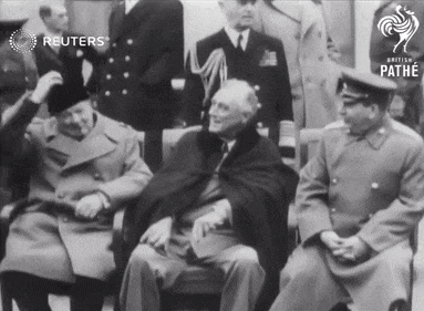 a group of men are sitting in front of a screen that says reuters