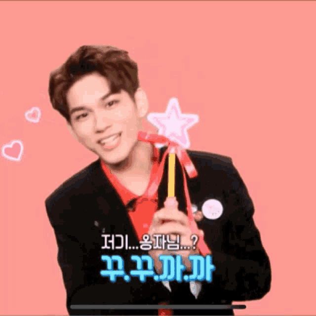 a man holding a wand with a star on it