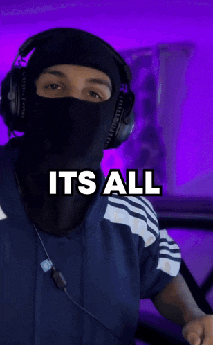 a man wearing headphones and a mask with the words its all sh * ts