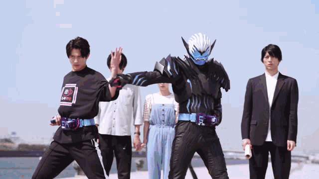 a group of people standing next to each other with one of them wearing a shirt that says ' samurai '