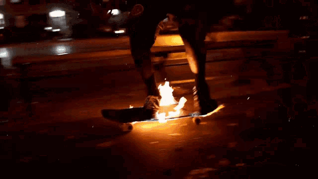 a person riding a skateboard with flames coming out of the wheels