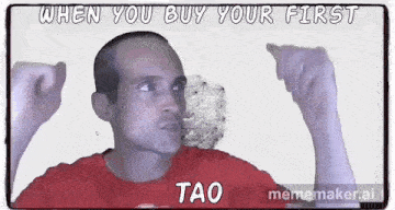 a man in a red shirt is making a funny face while pointing at something .