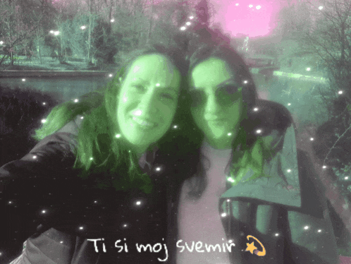 two women are posing for a picture and the words ti si moj svemir are written on the bottom
