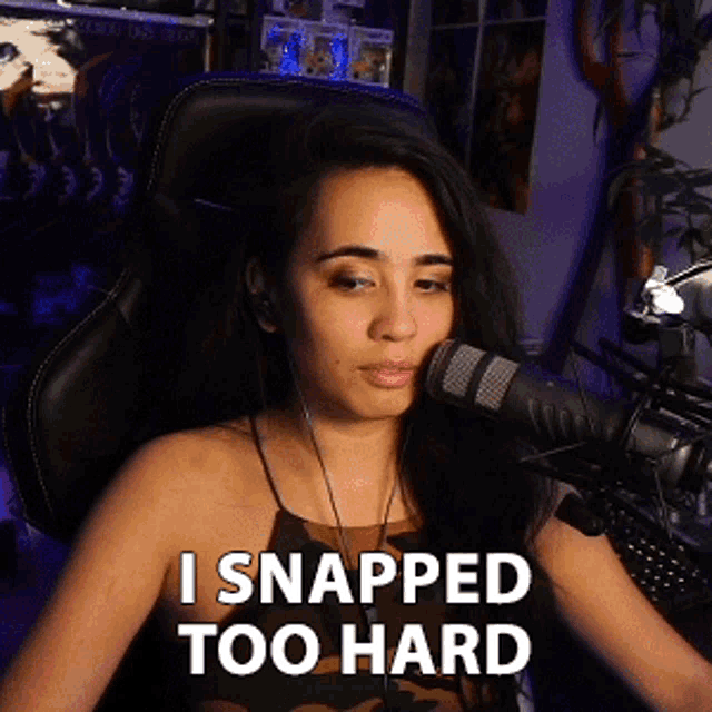 a woman sitting in front of a microphone with the words " i snapped too hard " on the bottom