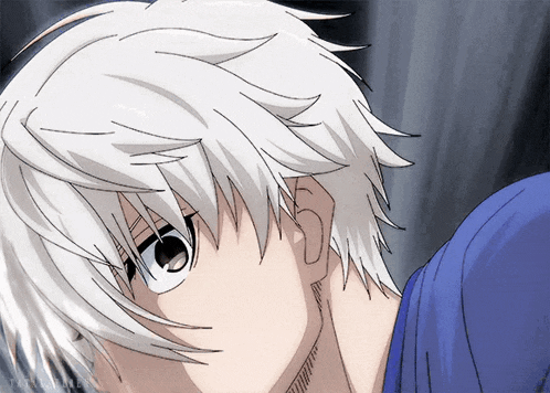 a close up of a person 's face with a blue shirt and white hair