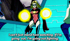 a woman in a superhero costume says i can t just stand here watching