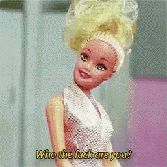 a barbie doll in a white dress says who the fuck are you