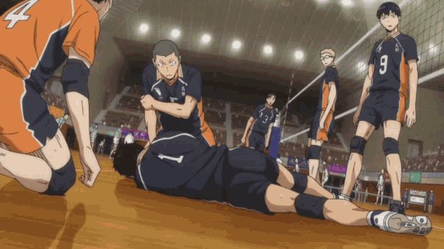 a group of volleyball players with one wearing a jersey with the number 9