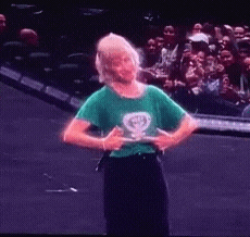 a woman wearing a green shirt with a female symbol on it