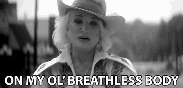a woman wearing a cowboy hat says " on my ol breathless body "