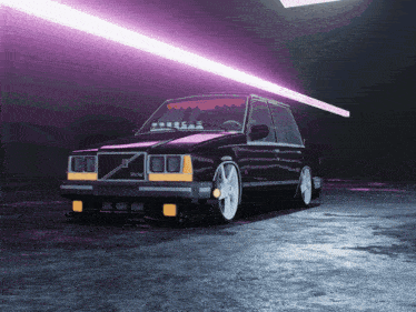 a black volvo car is parked in a dark garage