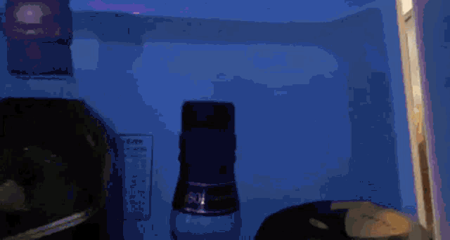 a bottle of johnnie walker sits next to a bottle of scotch