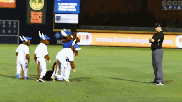 a man standing on a baseball field with a sign that says good pie in the background
