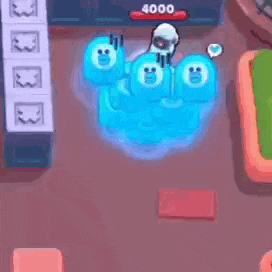 a person is playing a video game with a bunch of blue ghosts on the floor .