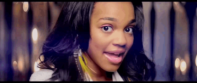 a close up of a woman 's face with a blurry background