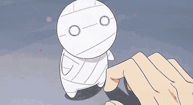 a cartoon of a mummy being touched by someone 's finger