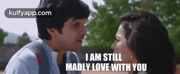 a man and a woman are kissing each other and the man is saying `` i am still madly love with you '' .