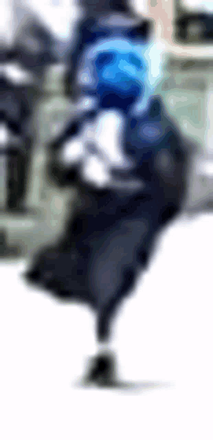 a blurry picture of a person wearing a blue mask