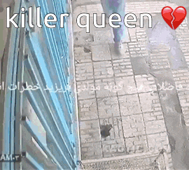 a person walking down a sidewalk with the words " killer queen " written above them