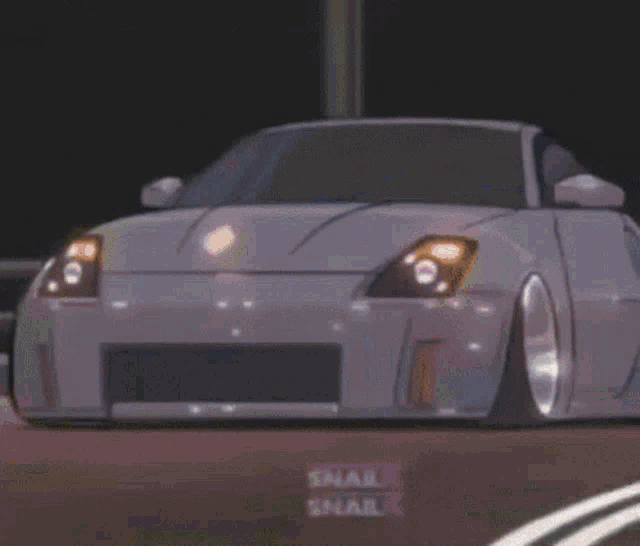a white truck is parked on a dirt road with a sign that says ' snail ' on it .