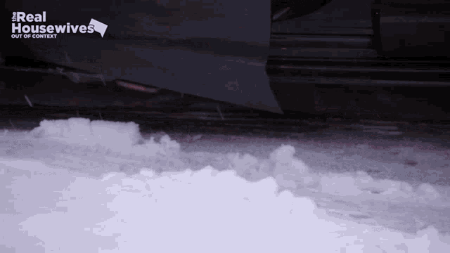 a real housewives logo is on the side of a snowy car