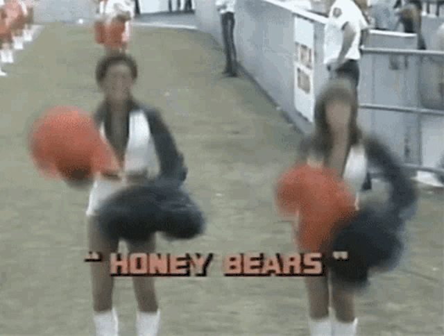 two cheerleaders are dancing with the words honey bears on the bottom
