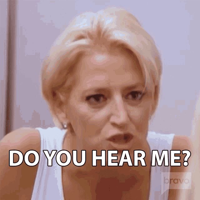 a woman is making a funny face and says do you hear me ?