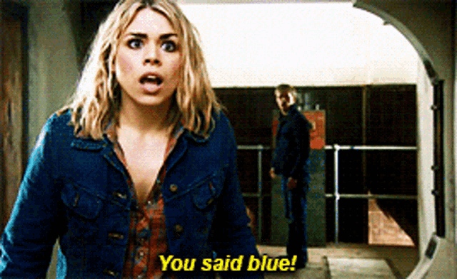 a woman in a denim jacket says " you said blue " in front of a man