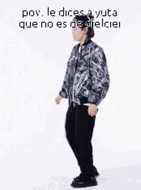 a man in a camouflage jacket is standing on one leg ..