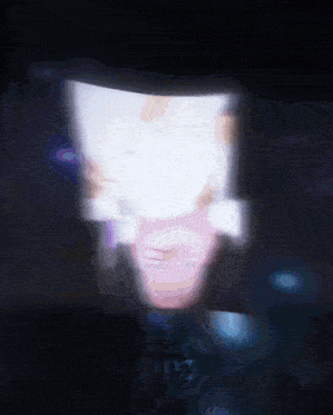 a blurred image of a person 's face with a top hat