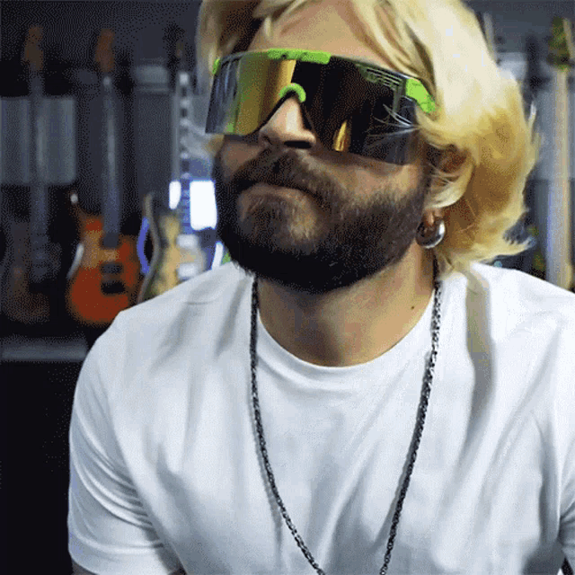 a man with a beard wearing a pair of pittsburgh sunglasses