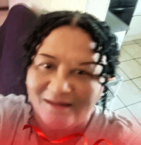 a woman with a red ribbon around her neck