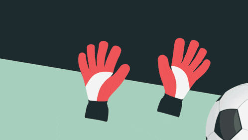a soccer ball is being kicked by a pair of red gloves