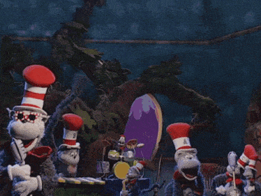 a cat in the hat is wearing a red and white top hat and a bow tie .
