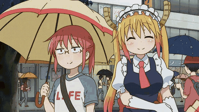 a girl in a life shirt holds an umbrella next to another girl