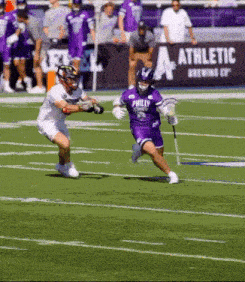 a lacrosse player in a purple jersey with the word philly on the back
