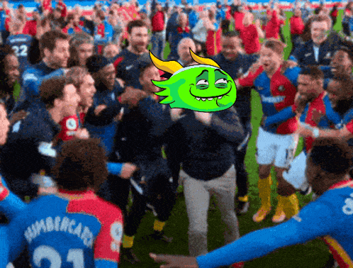 a group of soccer players are gathered on a field and one of their jerseys says humbercard