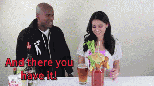 a man and a woman are sitting at a table with drinks and the words and there you have it on the bottom