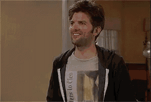 a man wearing a hoodie and a t-shirt that says ' lovers to cleo ' on it