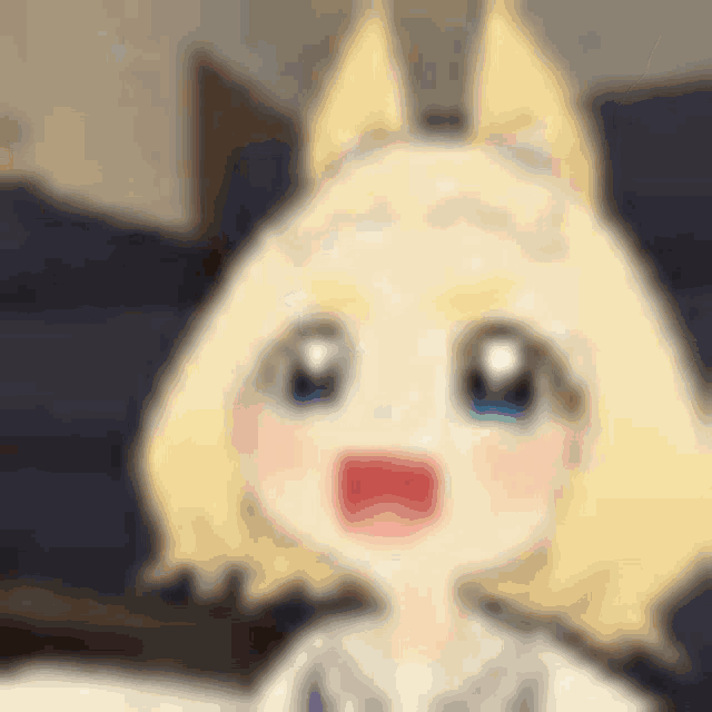 a blurred image of a cartoon character with blonde hair and ears .