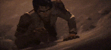 a close up of a man 's face with fire coming out of it .