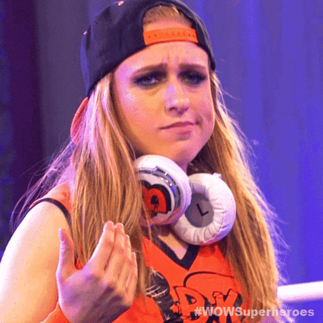 a woman wearing headphones and a hat with the words wow superheroes on the bottom right