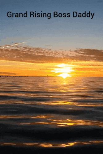a sunset over a body of water with the words grand rising boss daddy above it