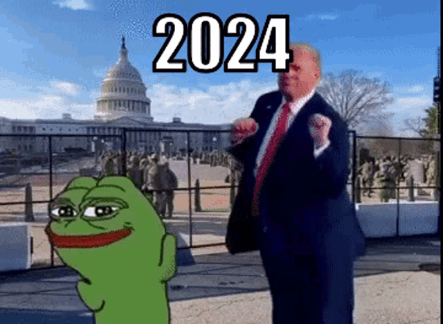 a man in a suit and tie is standing in front of a fence and a cartoon frog with the year 2024 on it