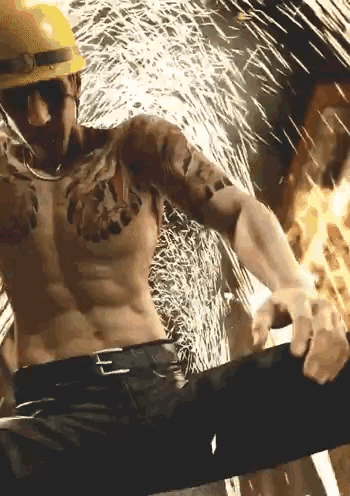 a shirtless man with tattoos on his arms and chest is wearing a hard hat and sunglasses .