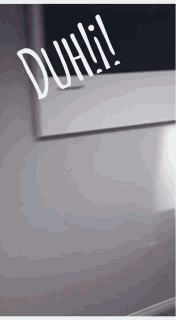 the word duh is on a white surface
