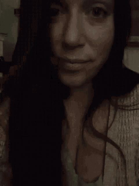 a woman is making a middle finger gesture