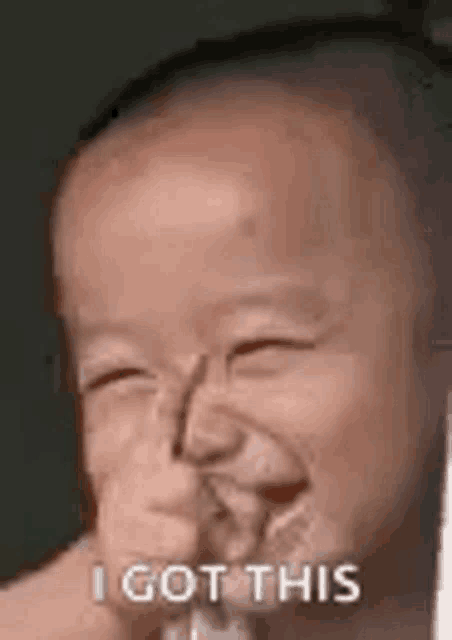 a baby is making a funny face while drinking from a straw .
