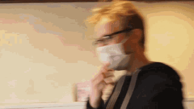 a blurry picture of a man wearing a mask