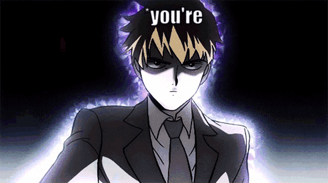 a man in a suit and tie with the words " you 're " on his head